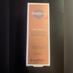 Alumier Clear Shield SPF 42. New - still sealed. 60 mL.